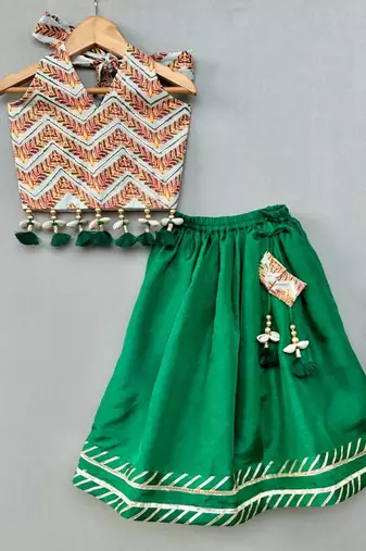 Stylish halter top with matching green lehenga for girls