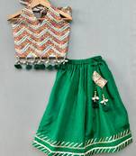 Stylish halter top with matching green lehenga for girls
