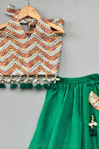 Stylish halter top with matching green lehenga for girls