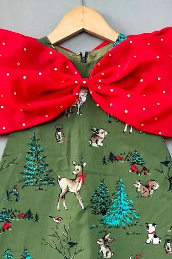 Animal printed green aline dress with big red bow for girls