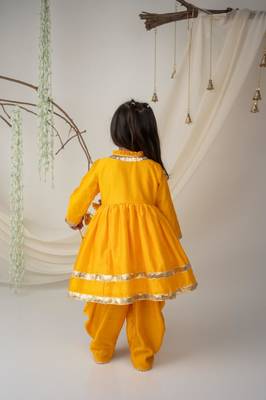 Yellow angrakha style kurti with matching dhoti for girls 3