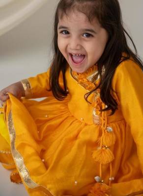 Yellow angrakha style kurti with matching dhoti for girls 4