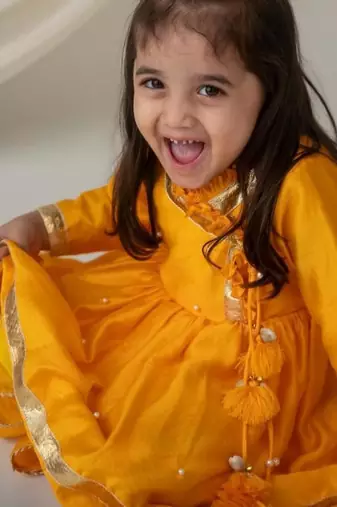 Yellow angrakha style kurti with matching dhoti for girls