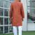 Cotton blend woven self desing rust kurta and pyjamas