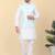 Men silk blend cream kurta and churidar with embroidered blue nehru jacket