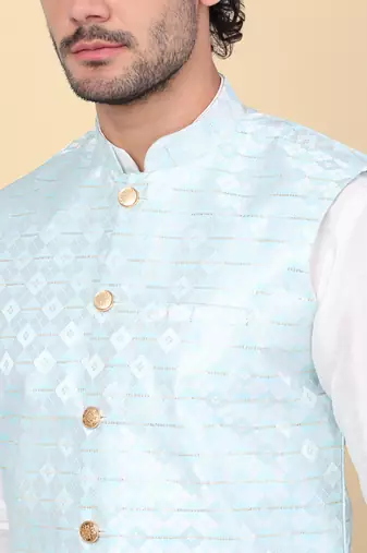 Men silk blend cream kurta and churidar with embroidered blue nehru jacket