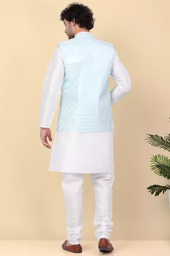 Men silk blend cream kurta and churidar with embroidered blue nehru jacket