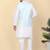 Men silk blend cream kurta and churidar with embroidered blue nehru jacket