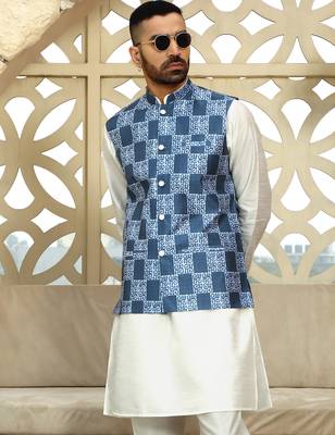 Silk blend solid cream kurta and churidar with blue printed nehru jacket 1