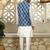 Silk blend solid cream kurta and churidar with blue printed nehru jacket
