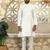 Silk blend solid cream kurta and churidar with blue printed nehru jacket