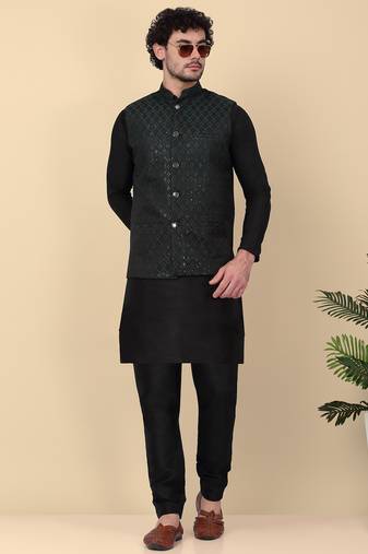 Men silk blend black kurta and churidar with embroidered green nehru jacket