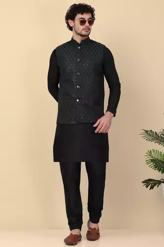 Men silk blend black kurta and churidar with embroidered green nehru jacket