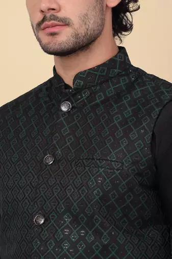 Men silk blend black kurta and churidar with embroidered green nehru jacket