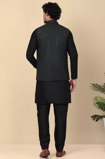 Men silk blend black kurta and churidar with embroidered green nehru jacket