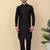 Men silk blend black kurta and churidar with embroidered green nehru jacket