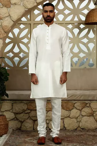 Silk blend solid cream kurta and churidar with floral blue nehru jacket