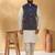 Silk blend cream kurta and churidar with jacquard geometric blue nehru jacket