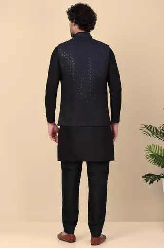 Men silk blend black kurta and churidar with embroidered navy blue nehru jacket