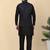 Men silk blend black kurta and churidar with embroidered navy blue nehru jacket