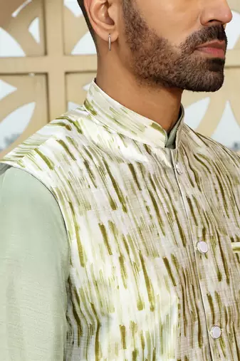 Silk blend solid olive green kurta and churidar with tie-dye green nehru jacket