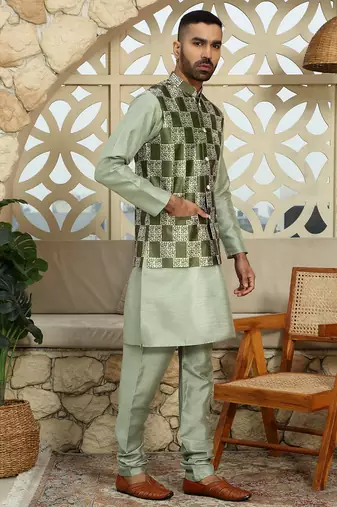 Silk blend solid olive kurta and churidar with green printed nehru jacket