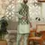 Silk blend solid olive kurta and churidar with green printed nehru jacket