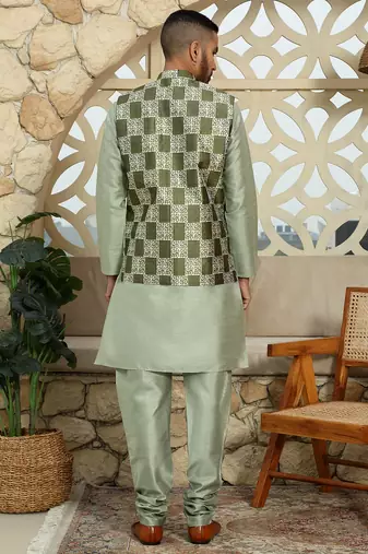 Silk blend solid olive kurta and churidar with green printed nehru jacket