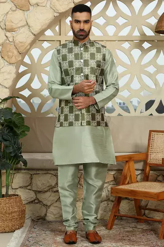 Silk blend solid olive kurta and churidar with green printed nehru jacket
