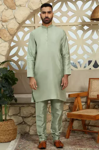 Silk blend solid olive kurta and churidar with green printed nehru jacket