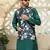 Silk blend solid green kurta and churidar with floral nehru jacket