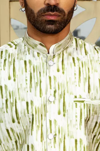 Silk blend solid cream kurta and churidar with tie-dye green nehru jacket