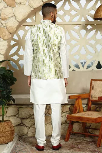 Silk blend solid cream kurta and churidar with tie-dye green nehru jacket