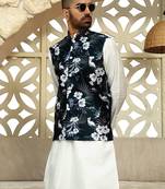 Silk blend solid cream kurta and churidar with floral green nehru jacket