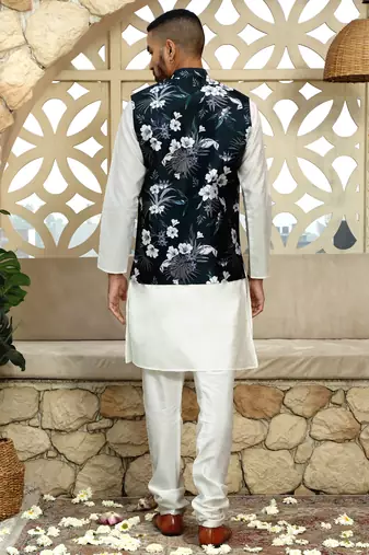Silk blend solid cream kurta and churidar with floral green nehru jacket