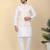 Men silk blend cream kurta and churidar with embroidered beige nehru jacket
