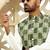 Silk blend solid cream kurta and churidar with green printed nehru jacket