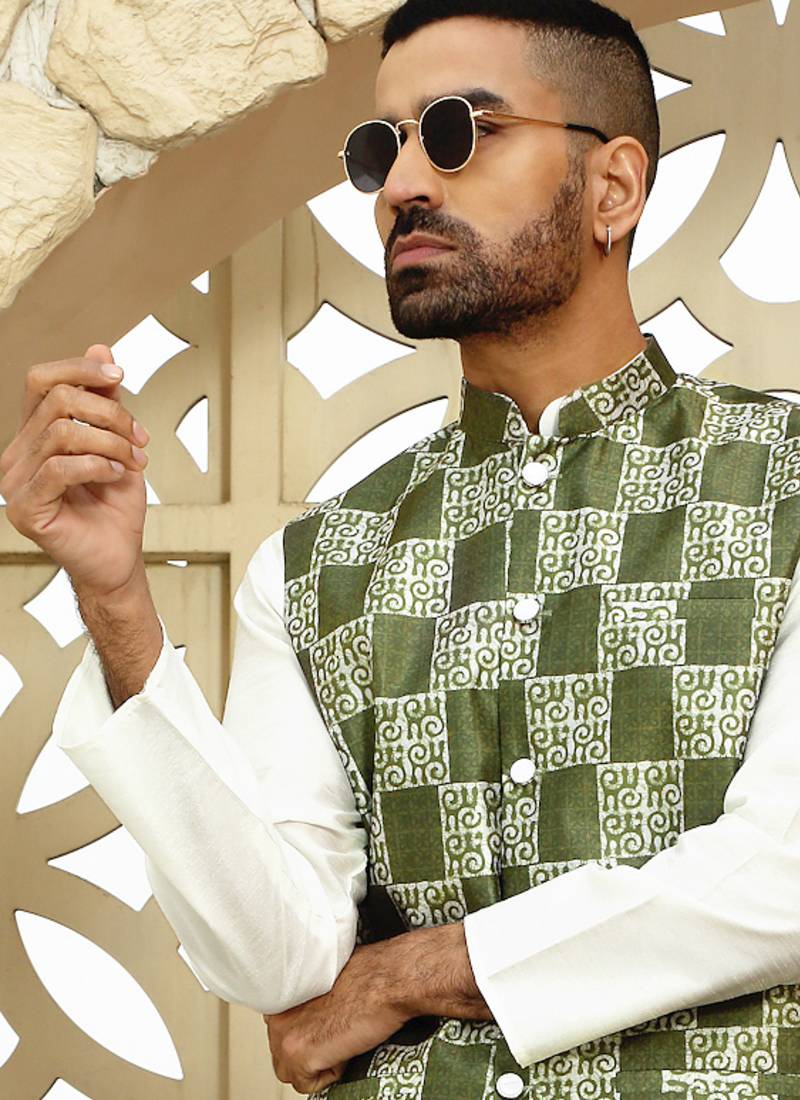 Silk blend solid cream kurta and churidar with green printed nehru jacket