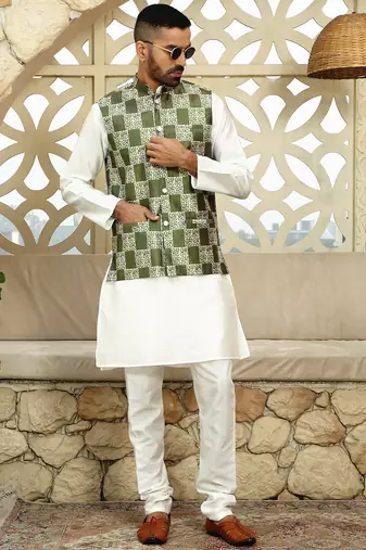 Silk blend solid cream kurta and churidar with green printed nehru jacket