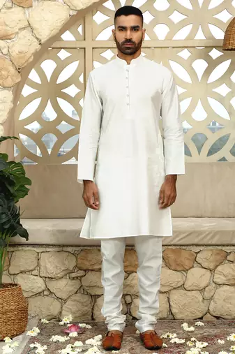 Silk blend solid cream kurta and churidar with green printed nehru jacket