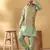 Silk bleand olive green kurta churidar with abstract printed green nehru jacket