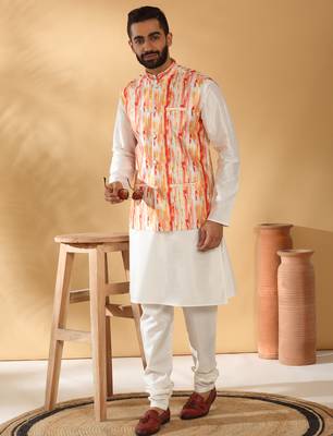 Silk blend cream kurta and churidar with tie-dye orange nehru jacket 1