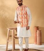Silk blend cream kurta and churidar with tie-dye orange nehru jacket