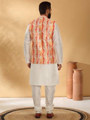Silk blend cream kurta and churidar with tie-dye orange nehru jacket 4