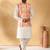 Silk blend cream kurta and churidar with tie-dye orange nehru jacket