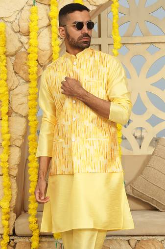 Silk blend solid yellow kurta and churidar with tie-dye yellow nehru jacket