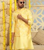 Silk blend solid yellow kurta and churidar with tie-dye yellow nehru jacket