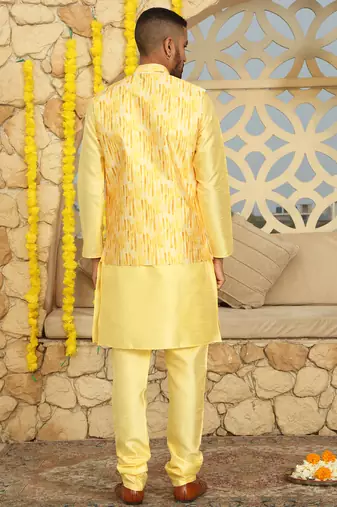 Silk blend solid yellow kurta and churidar with tie-dye yellow nehru jacket