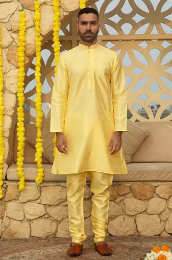 Silk blend solid yellow kurta and churidar with tie-dye yellow nehru jacket