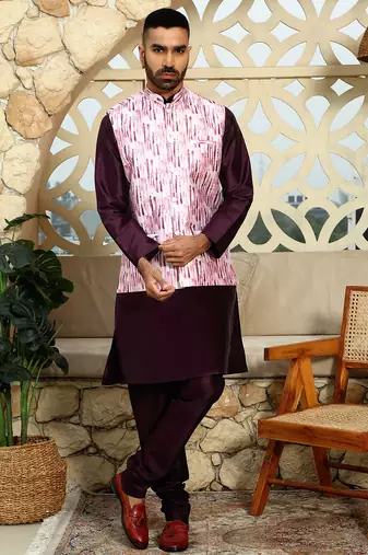 Silk blend solid purple kurta and churidar with tie-dye wine nehru jacket